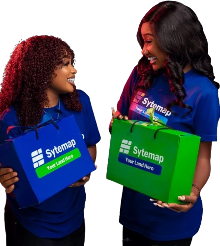 Two Sytemap team members smiling at each other, holding blue and green Sytemap gift bags