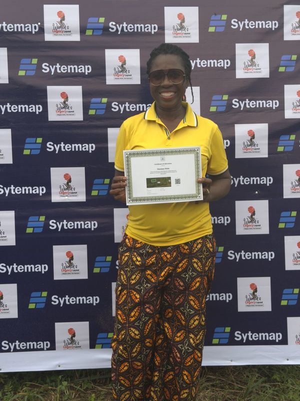 A landowner holding her Certificate of Allocation