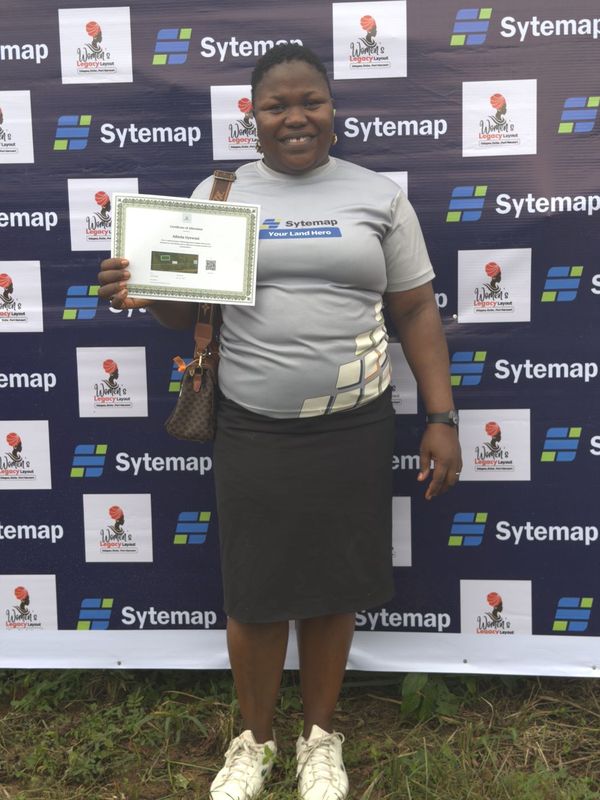 A landowner holding her Certificate of Allocation