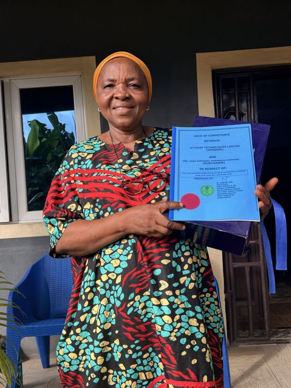 A landowner holding her land documents