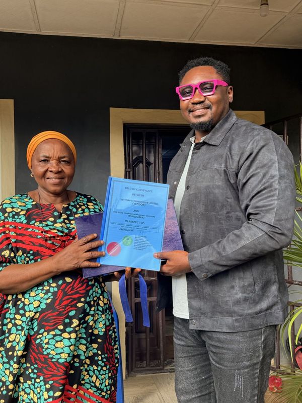 A landowner receiving her documents from the Sytemap team